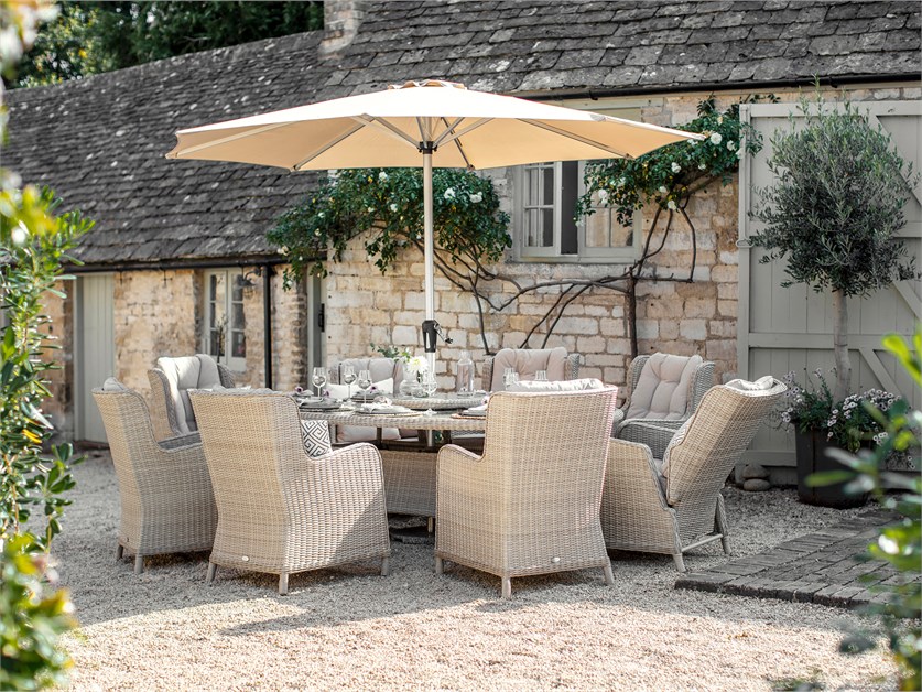 Chedworth Sandstone Rattan 8 Seat Elliptical Dining Set (including 2 Recliners) with Lazy Susan, Parasol & Base