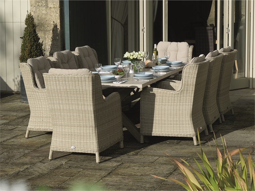 Chedworth Sandstone Ceramic Rectangle Table with 8 Rattan Armchairs